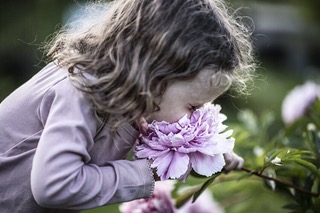 girl with face in flowers